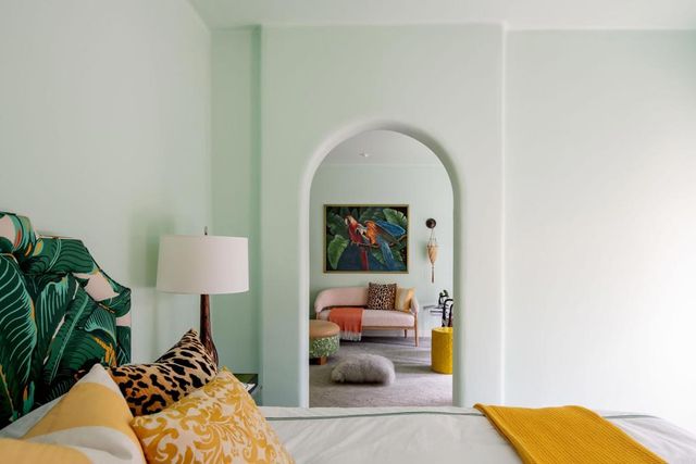 a living room with furniture and a lamp