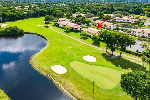 a view of a golf course with a swimming pool