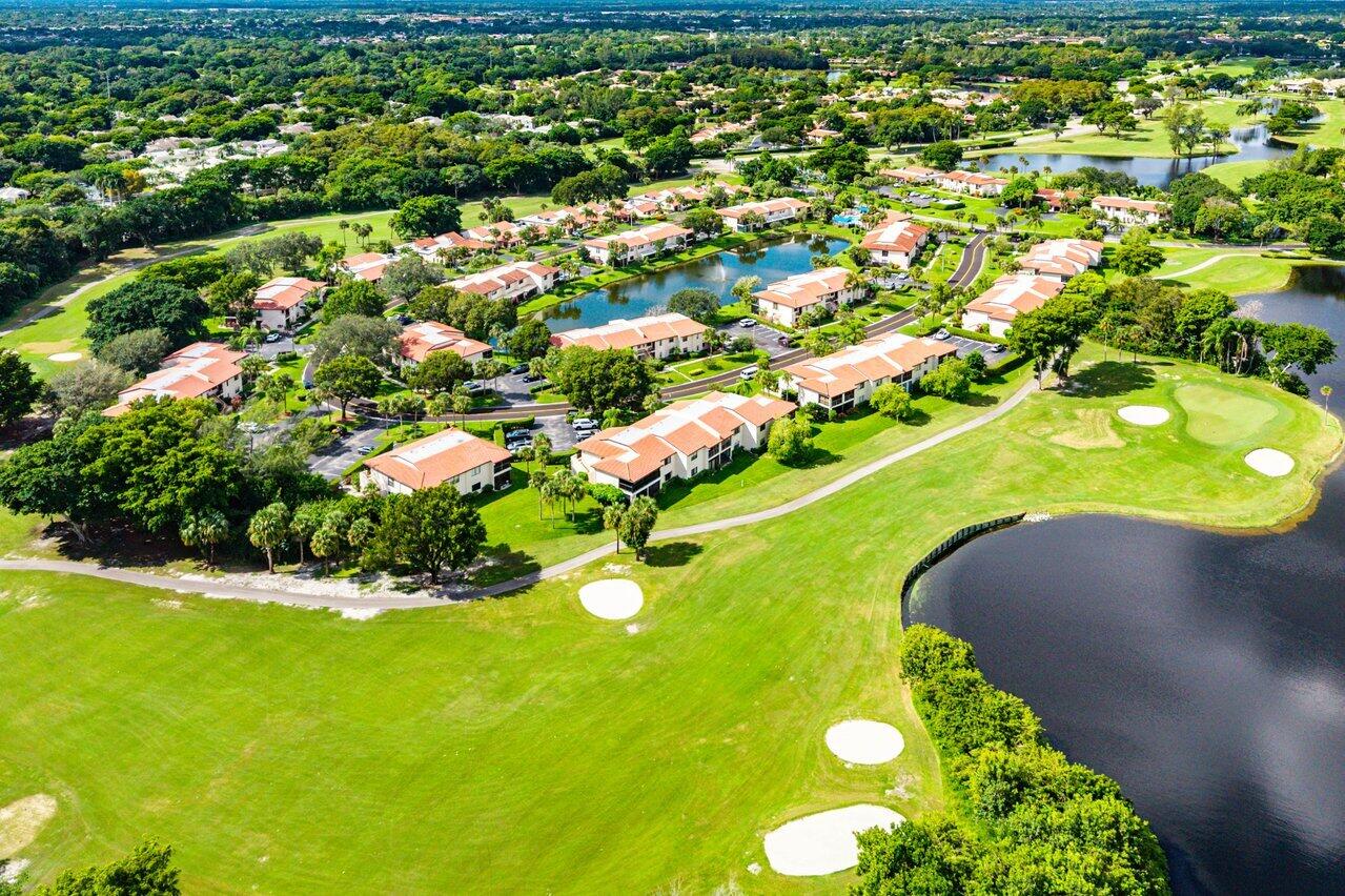 7920 Eastlake Drive, Unit 19B Boca Raton, FL 33433 - Photo 35 of 40 an aerial view of a residential houses with yard and swimming pool