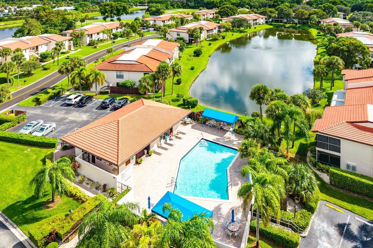 7920 Eastlake Drive, Unit 19B Boca Raton, FL 33433 - Photo 39 of 40 an aerial view of a house with a garden and lake view