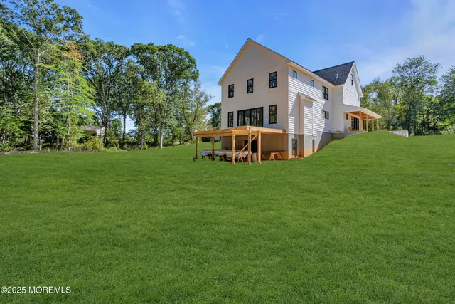 a front view of house with yard and green space