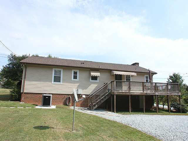 1337 Cole Mill Road Durham, NC 27705 - Photo 20 of 20 back view of house. large crawl space, could offer some storage Exterior Back