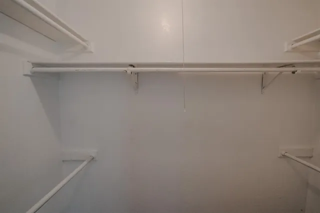 a view of a room with racks on the wall