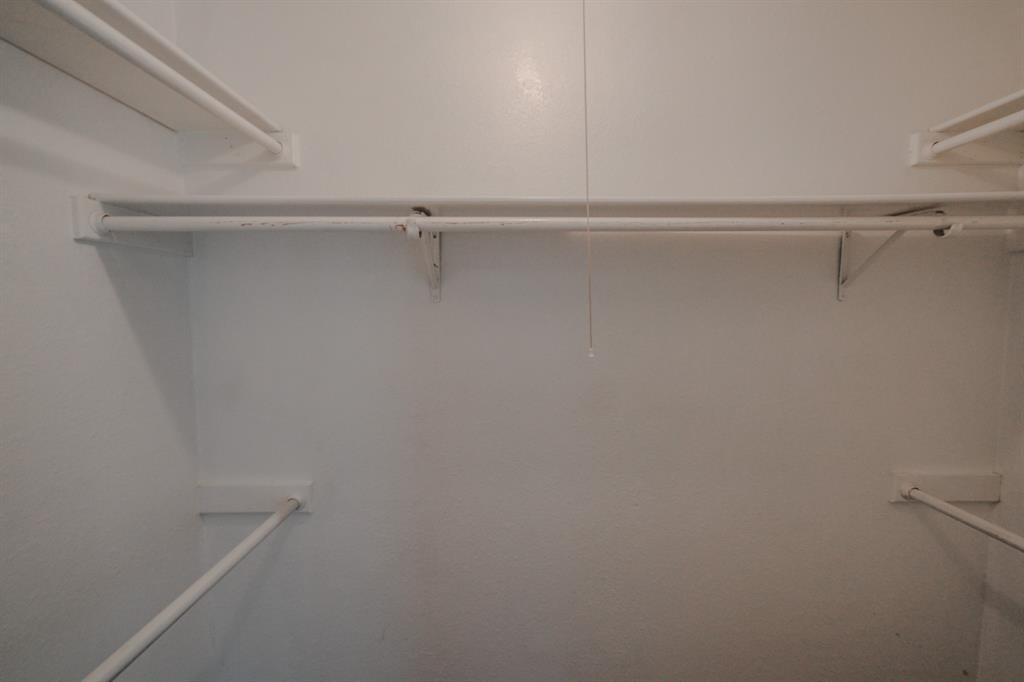 1032 McKinley Street, Unit A Benbrook, TX 76126 - Photo 10 of 14 a view of a room with racks on the wall