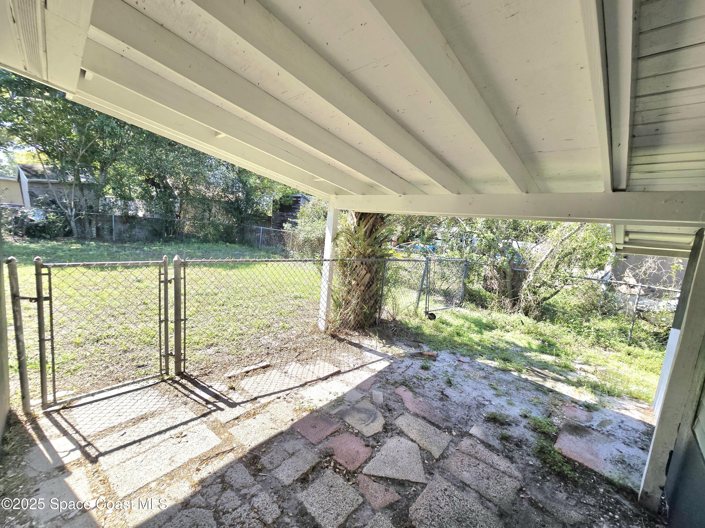2373 Allan Adale Road Melbourne, FL 32935 - Photo 17 of 19 a view of a garden from a windows
