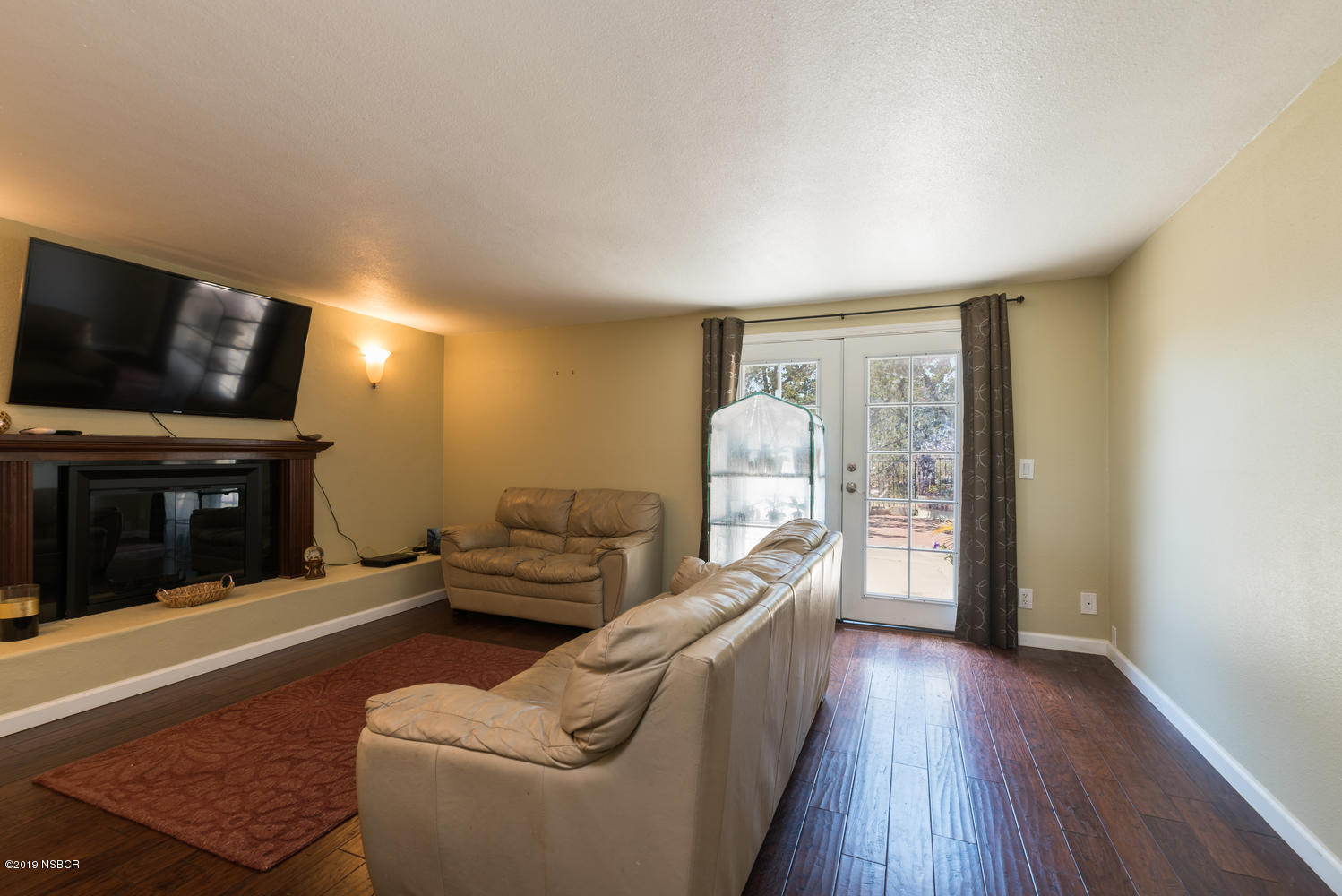 1386 Onstott Road Lompoc, CA 93436 - Photo 12 of 35 a living room with furniture and a flat screen tv