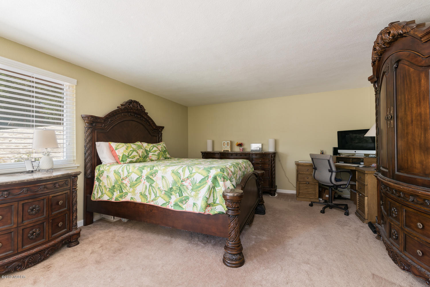 1386 Onstott Road Lompoc, CA 93436 - Photo 15 of 35 a bedroom with a bed and a tv