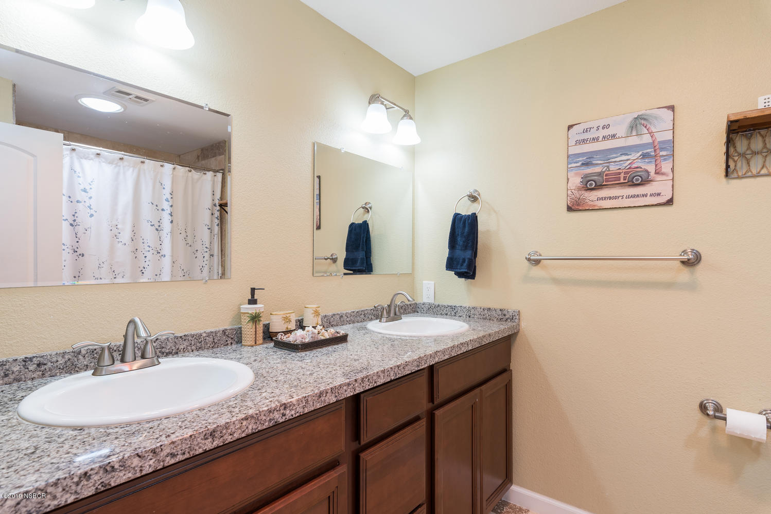 1386 Onstott Road Lompoc, CA 93436 - Photo 22 of 35 a bathroom with a granite countertop sink a mirror and a