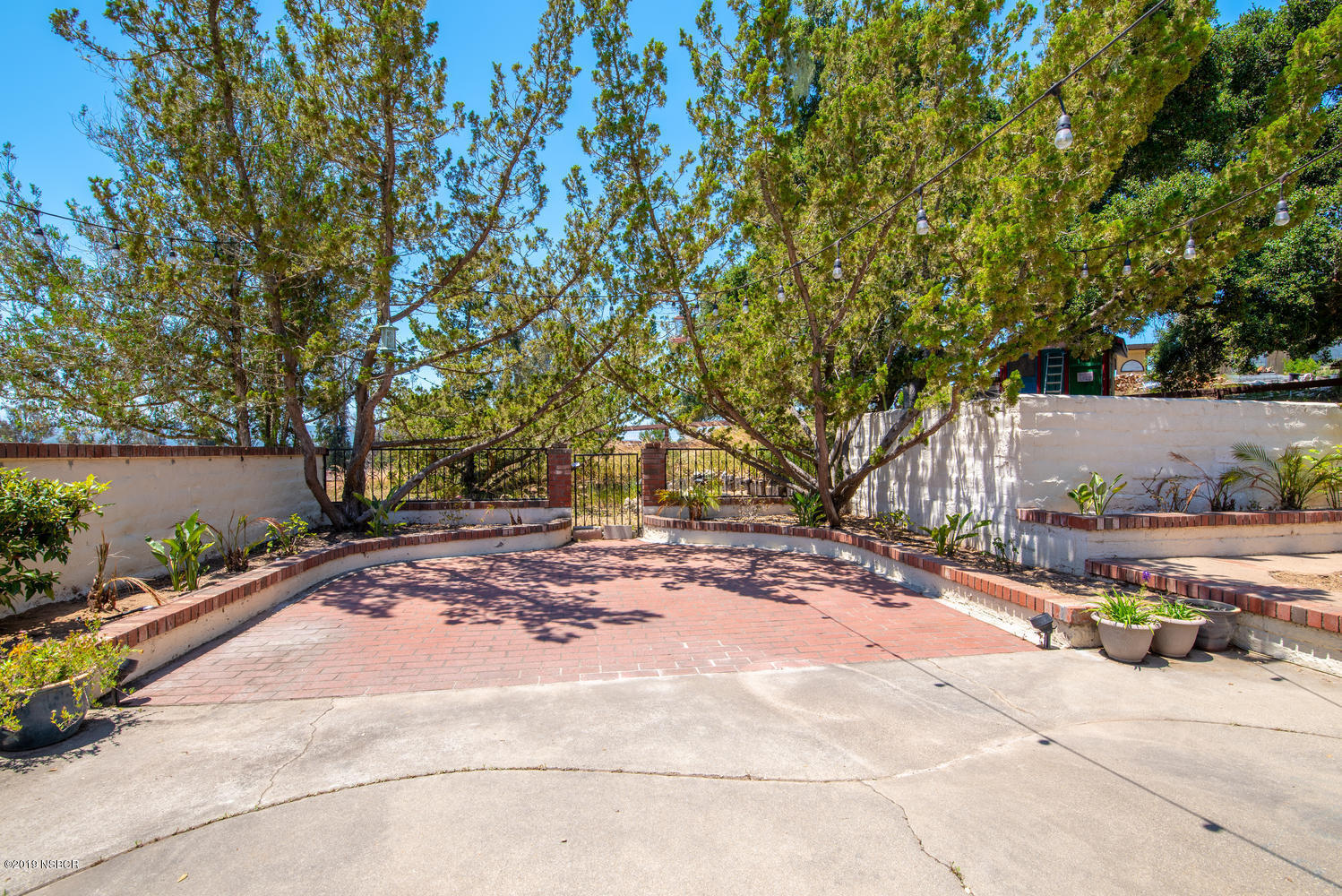 1386 Onstott Road Lompoc, CA 93436 - Photo 26 of 35 a street view with wooden fencing