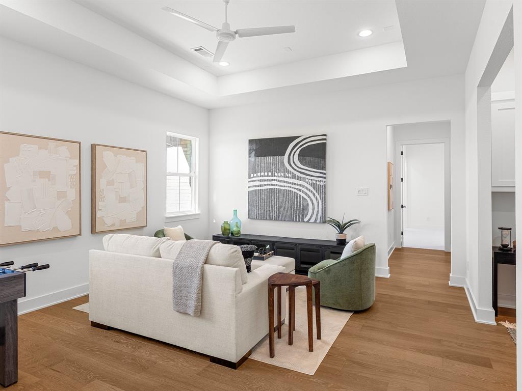 1301 Hunt Road Gunter, TX 75058 - Photo 19 of 40 a living room with furniture and a flat screen tv
