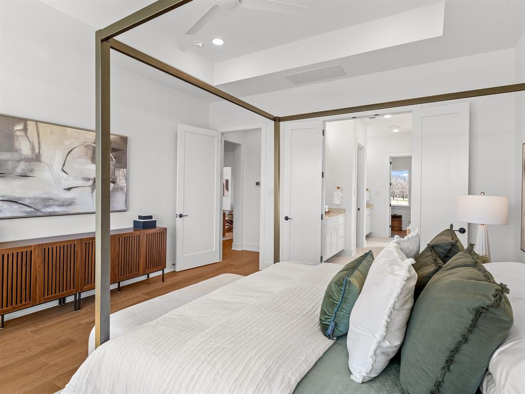 1301 Hunt Road Gunter, TX 75058 - Photo 23 of 40 a bedroom with a bed and a large mirror