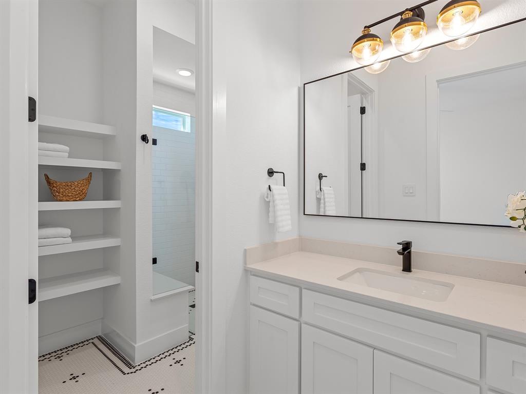 1301 Hunt Road Gunter, TX 75058 - Photo 34 of 40 a bathroom with a sink and a mirror