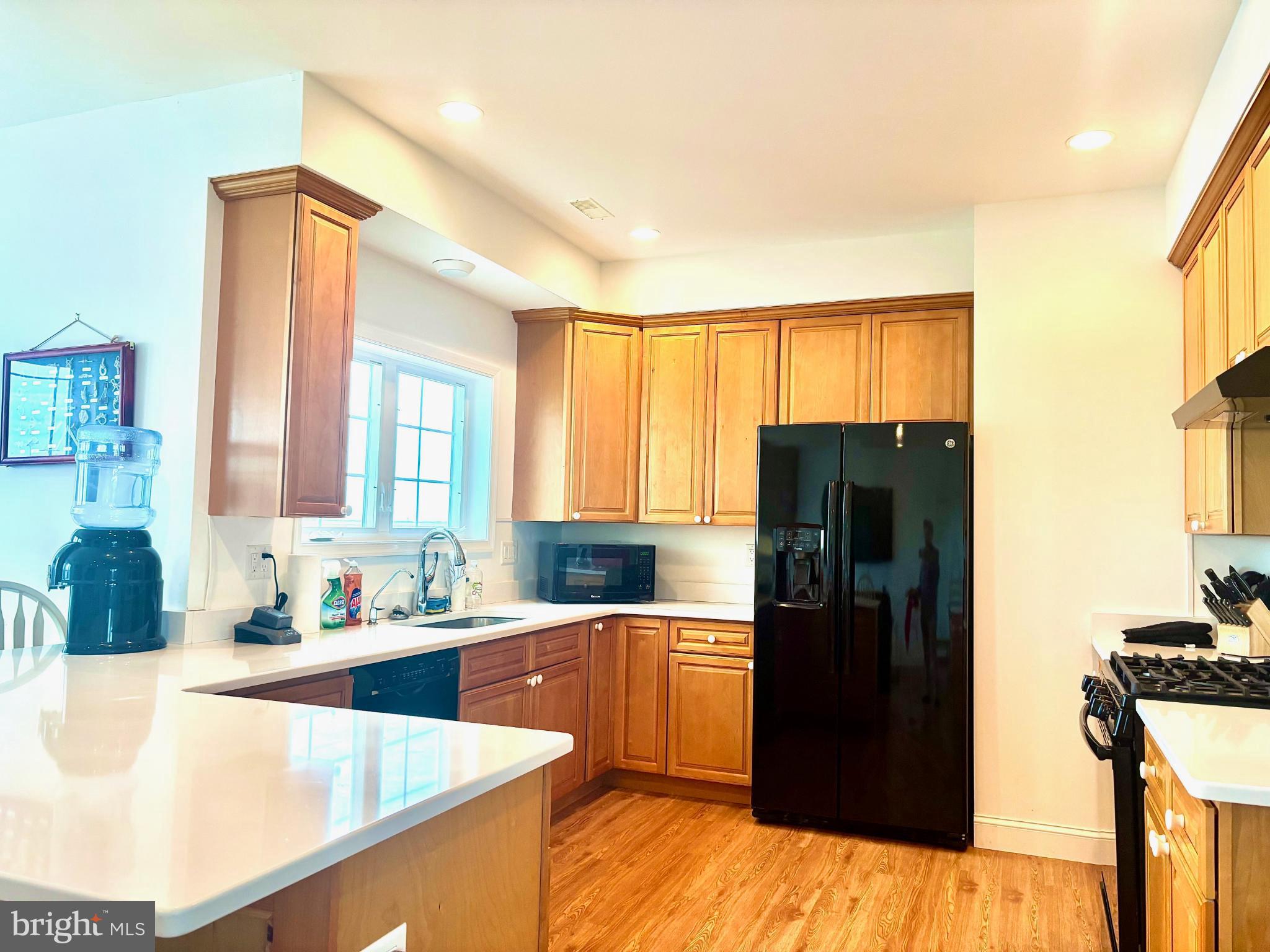 448 Dock Road West Creek, NJ 08092 - Photo 11 of 36 a kitchen with stainless steel appliances granite countertop a refrigerator a sink and a stove
