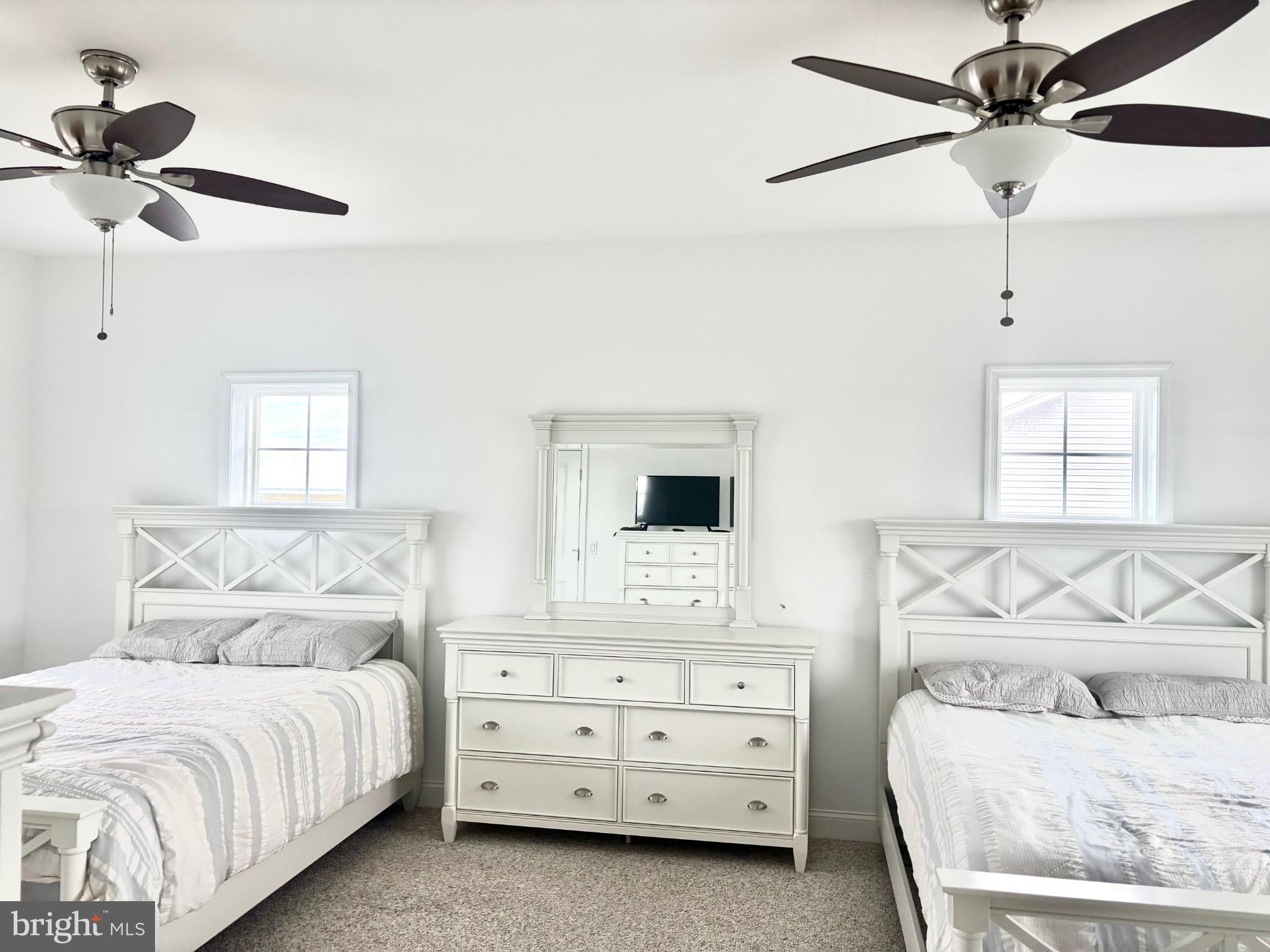 448 Dock Road West Creek, NJ 08092 - Photo 13 of 36 a bedroom with a bed and a chandelier fan