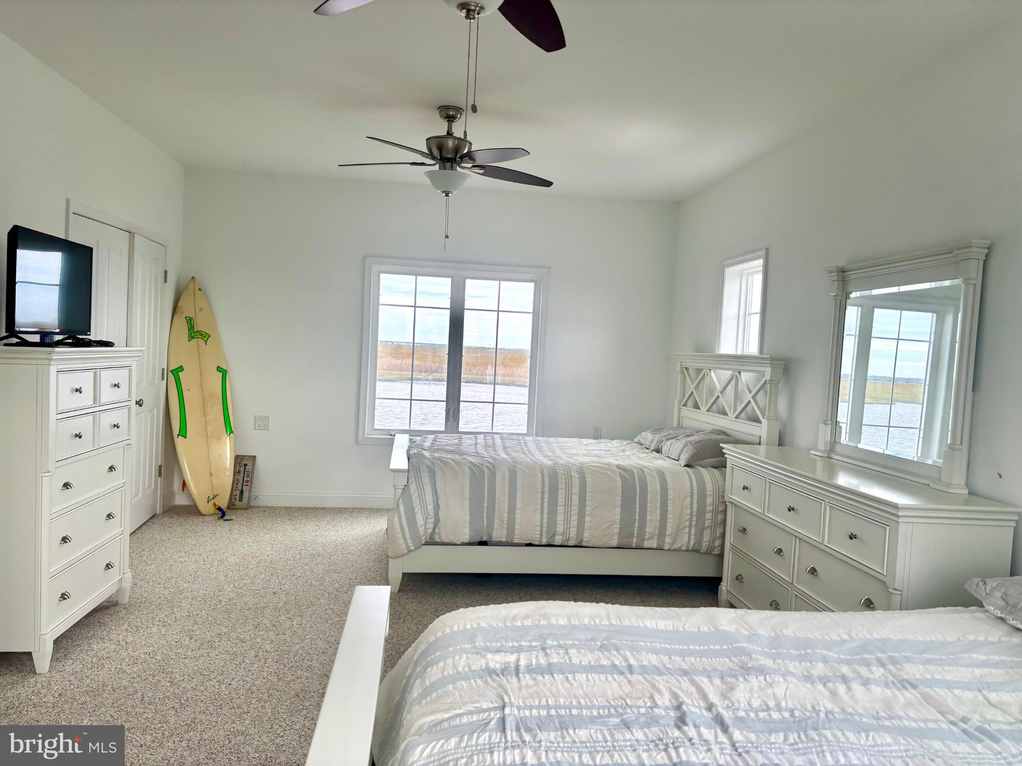 448 Dock Road West Creek, NJ 08092 - Photo 14 of 36 a spacious bedroom with a bed and a dresser