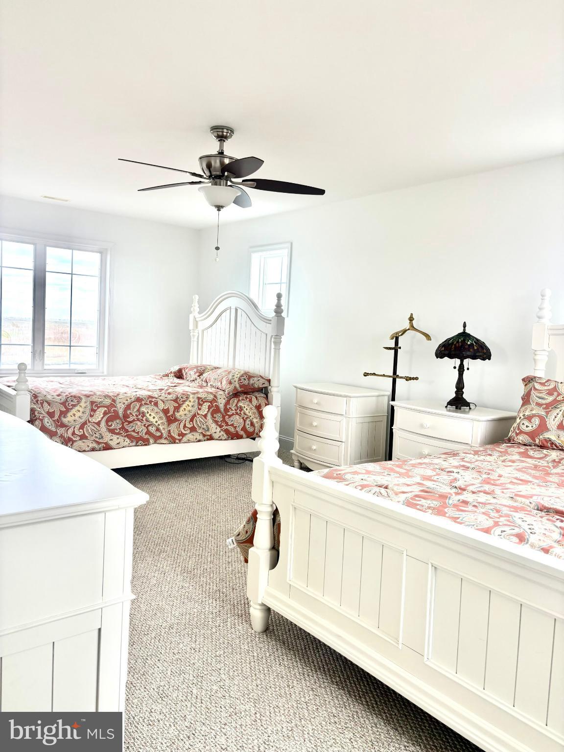 448 Dock Road West Creek, NJ 08092 - Photo 18 of 36 a bedroom with a bed a chandelier and dresser