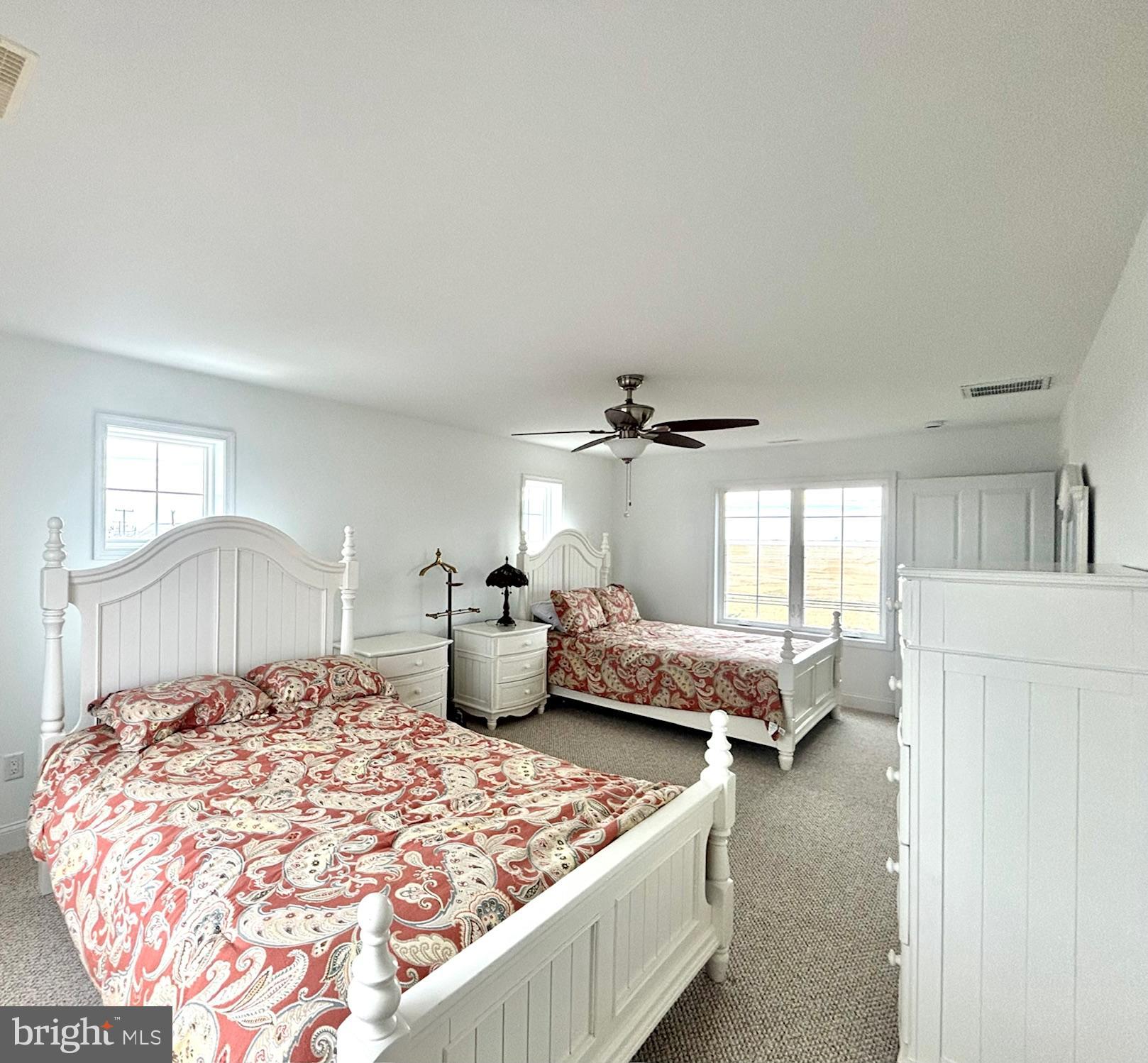 448 Dock Road West Creek, NJ 08092 - Photo 19 of 36 a bedroom with a large bed and a chandelier
