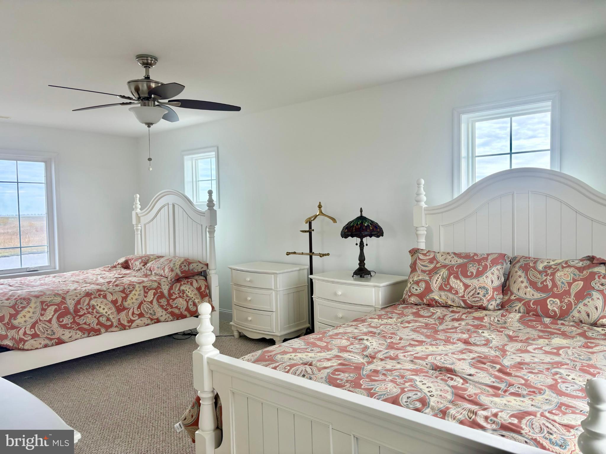 448 Dock Road West Creek, NJ 08092 - Photo 20 of 36 a bedroom with a bed and a chandelier