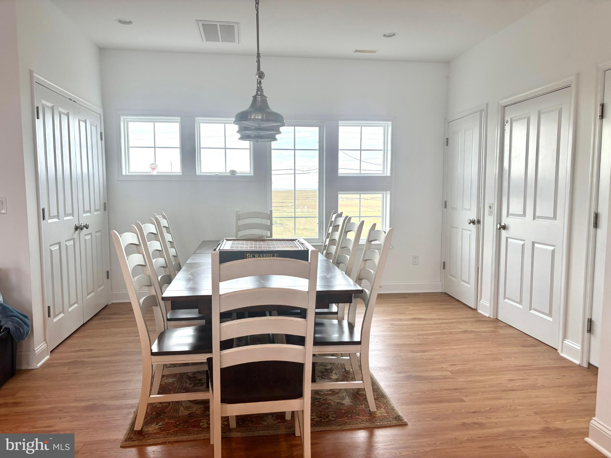 448 Dock Road West Creek, NJ 08092 - Photo 8 of 36 a view of a dining room with furniture window and wooden floor