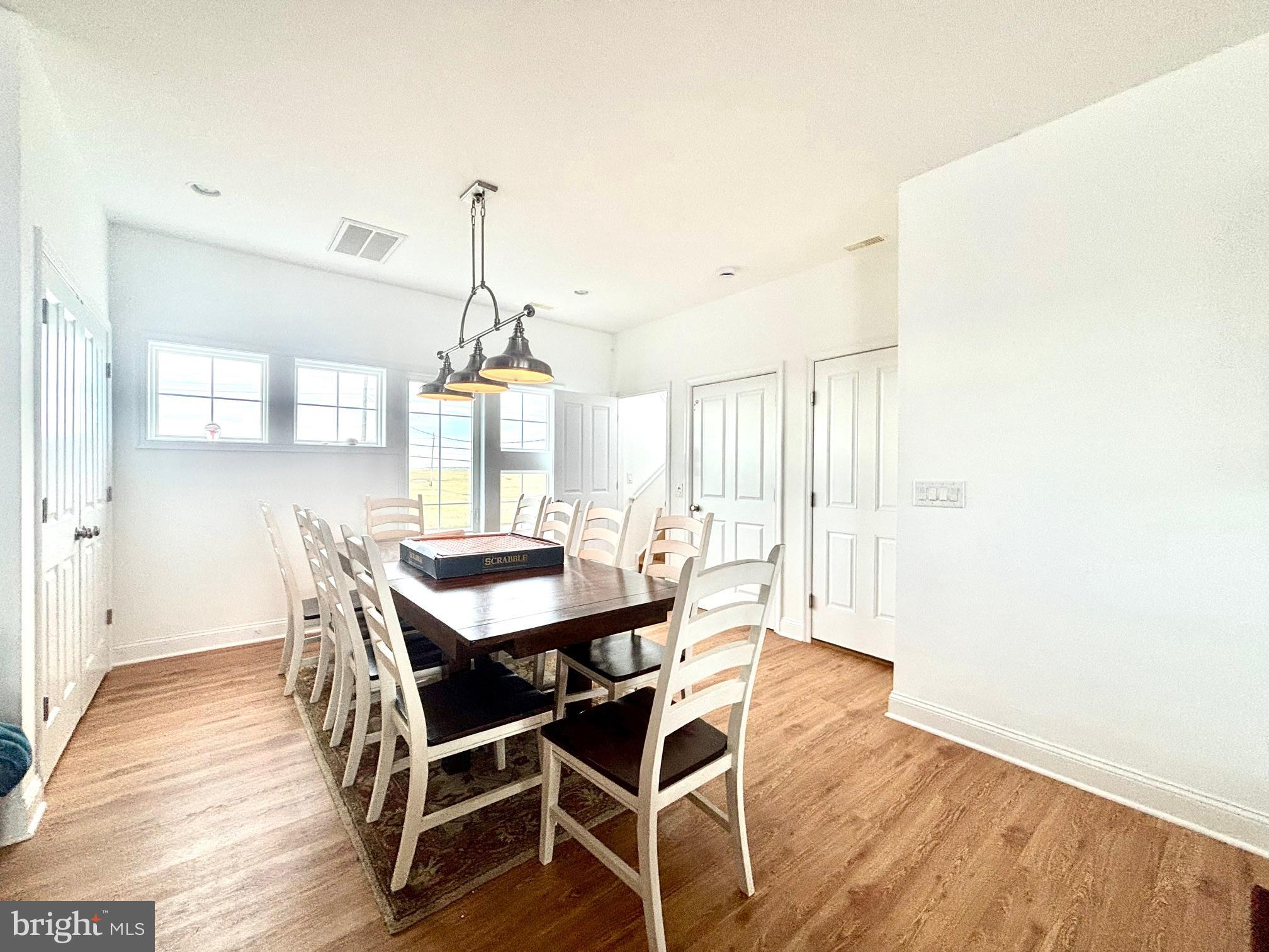 448 Dock Road West Creek, NJ 08092 - Photo 9 of 36 a dining room with furniture window and wooden floor