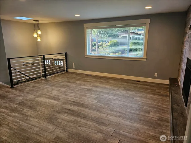 a view of an empty room with windows