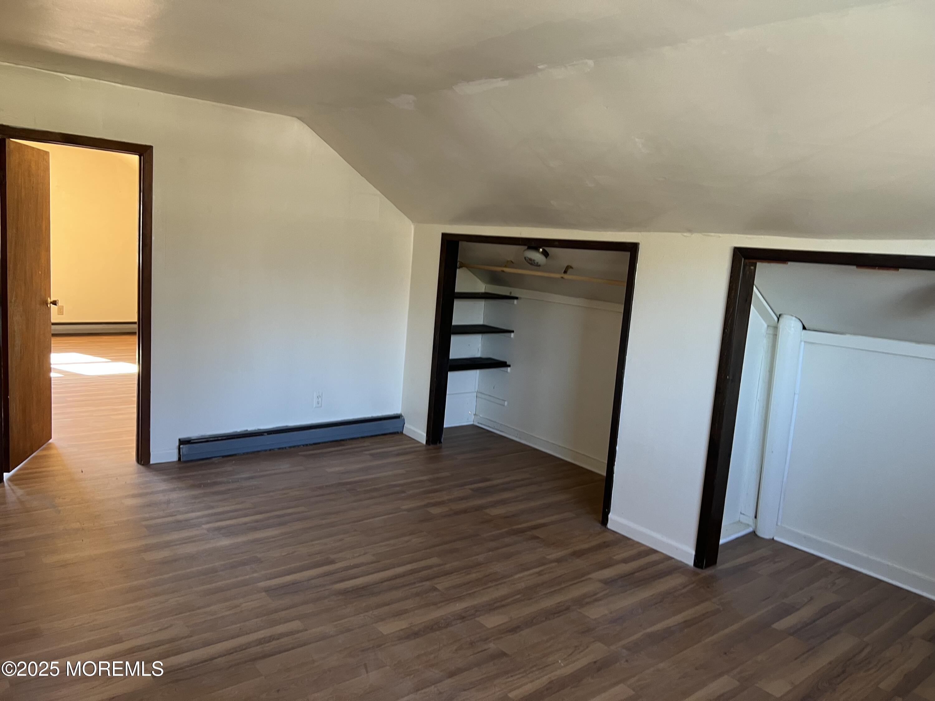 84 Bethany Road Hazlet, NJ 07730 - Photo 14 of 21 an empty room with wooden floor and closet