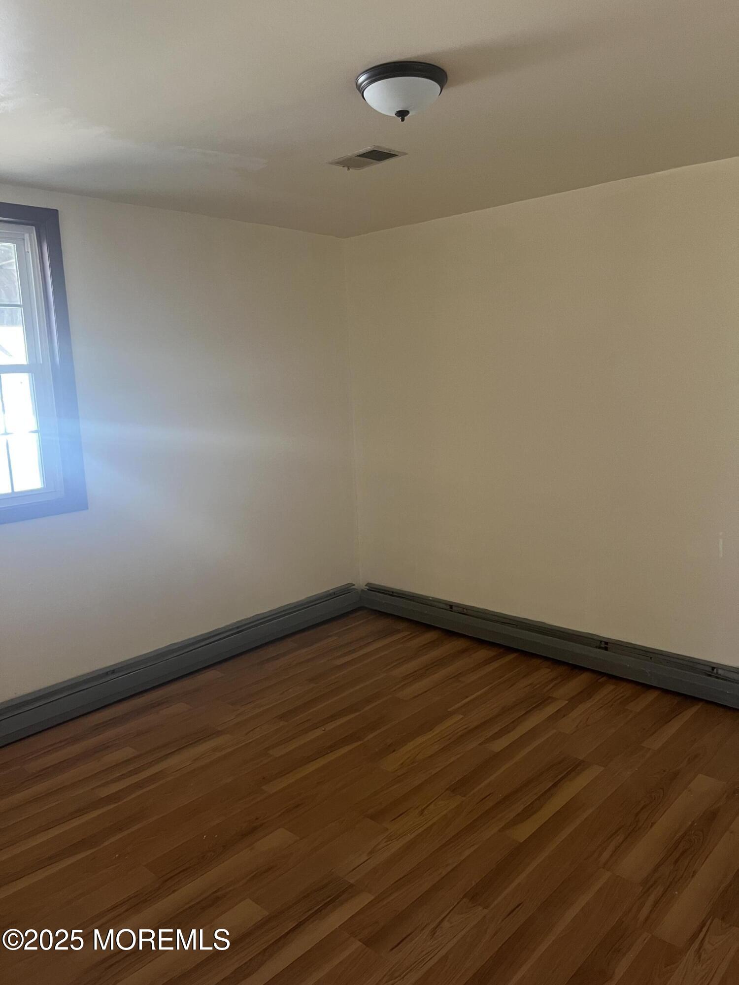 84 Bethany Road Hazlet, NJ 07730 - Photo 19 of 21 a view of an empty room with a window