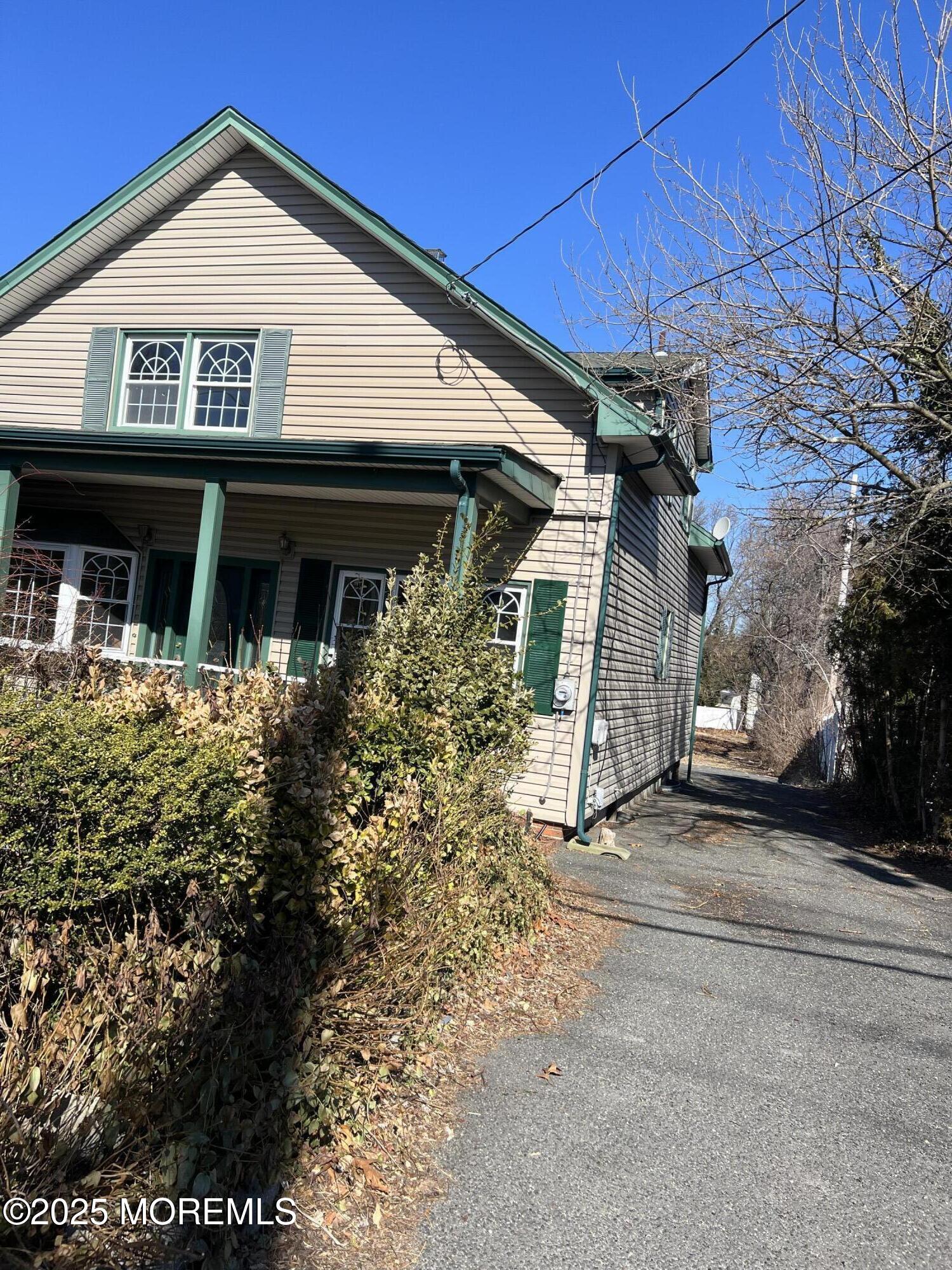84 Bethany Road Hazlet, NJ 07730 - Photo 2 of 21 a view of a house with a small yard and potted plants