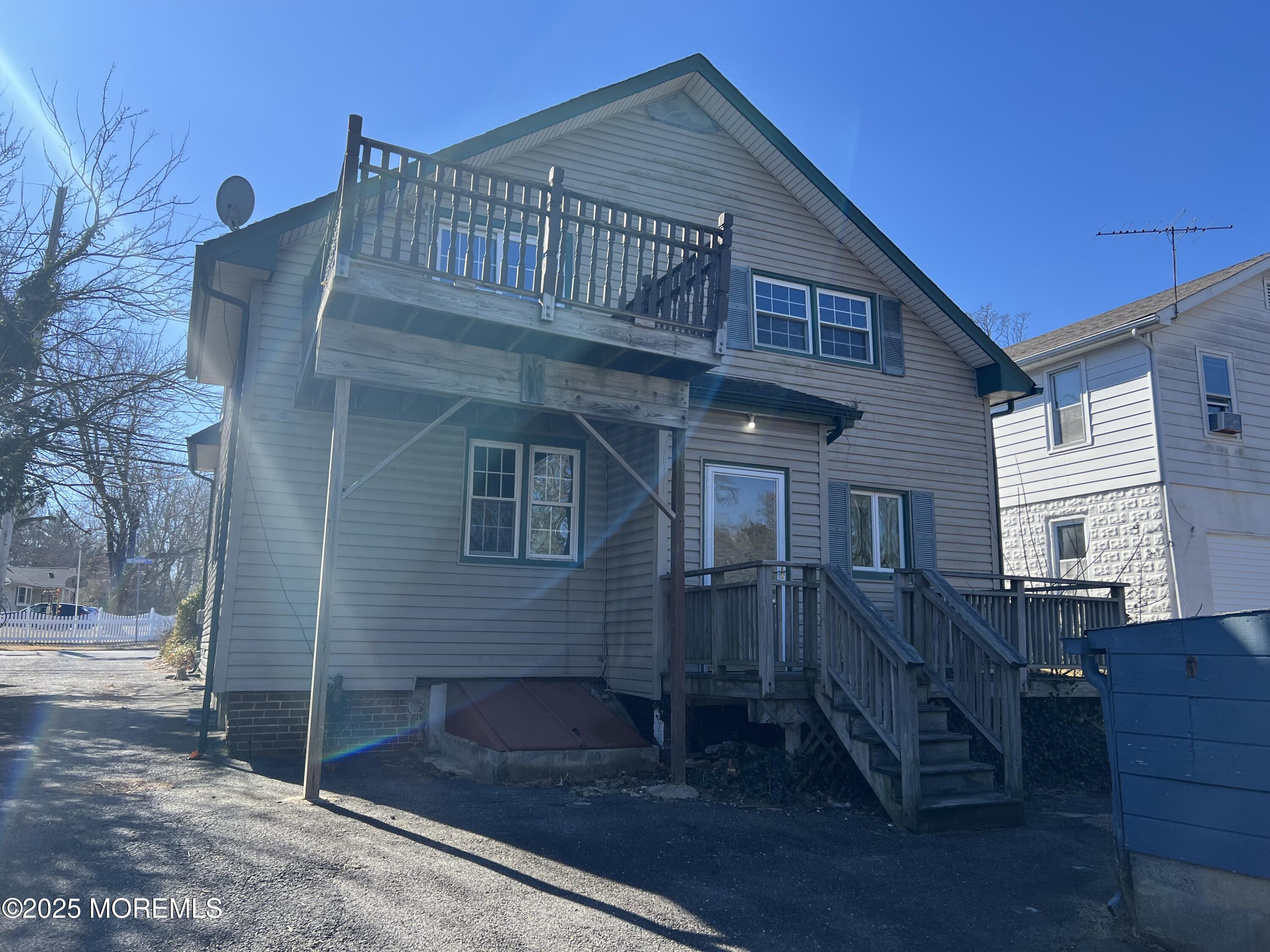 84 Bethany Road Hazlet, NJ 07730 - Photo 8 of 21 a view of a house with a deck