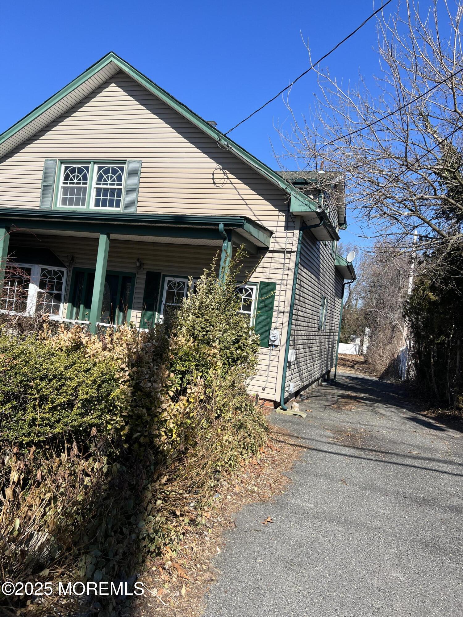 84 Bethany Road Hazlet, NJ 07730 - Photo 10 of 21 a view of a house with a small yard and potted plants