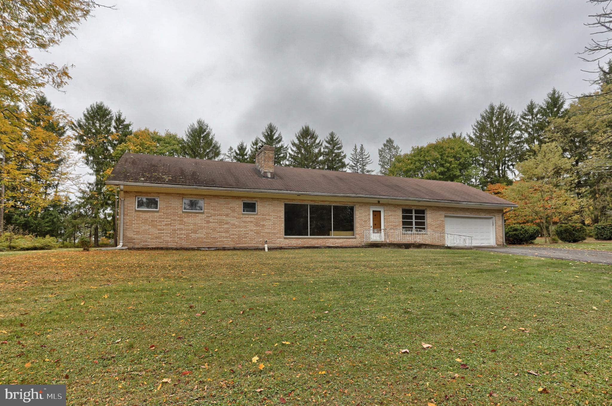 77 Tiley Road Ashland, PA 17921 - Photo 1 of 35 a house view with a garden space