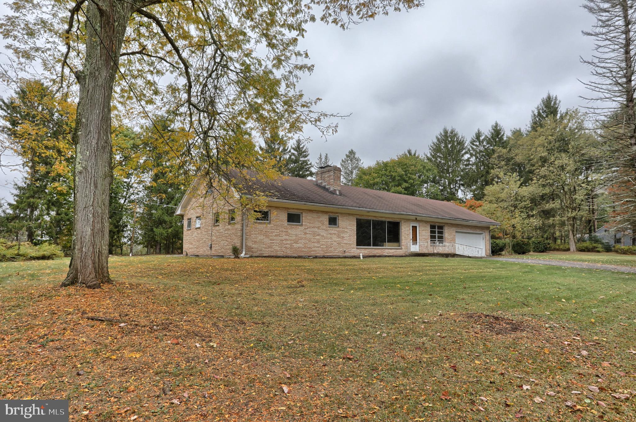 77 Tiley Road Ashland, PA 17921 - Photo 17 of 35 a house with trees in front of it