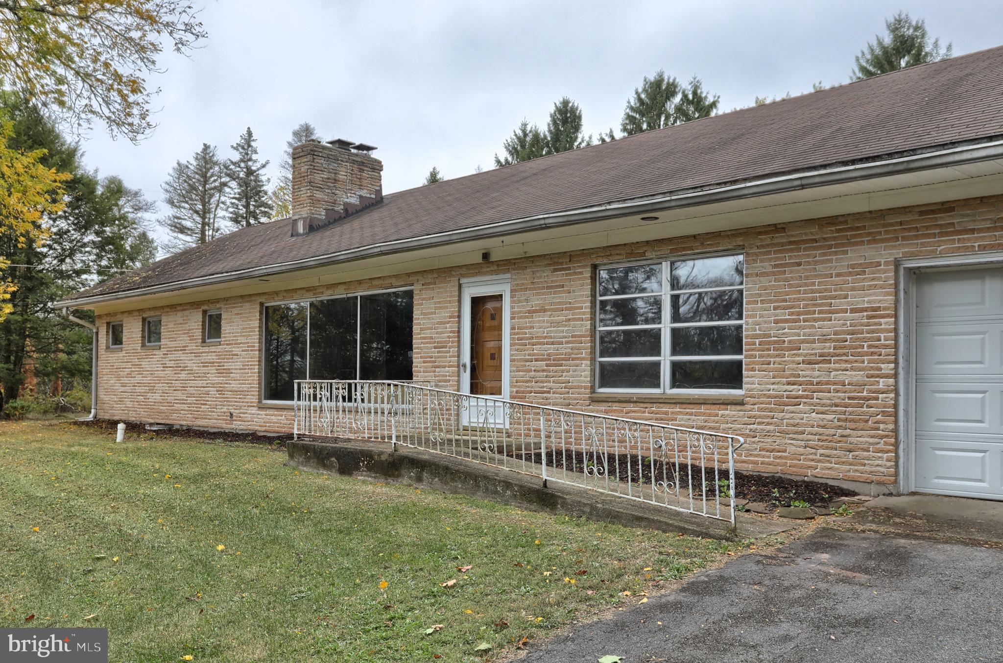 77 Tiley Road Ashland, PA 17921 - Photo 18 of 35 a front view of a house with garden