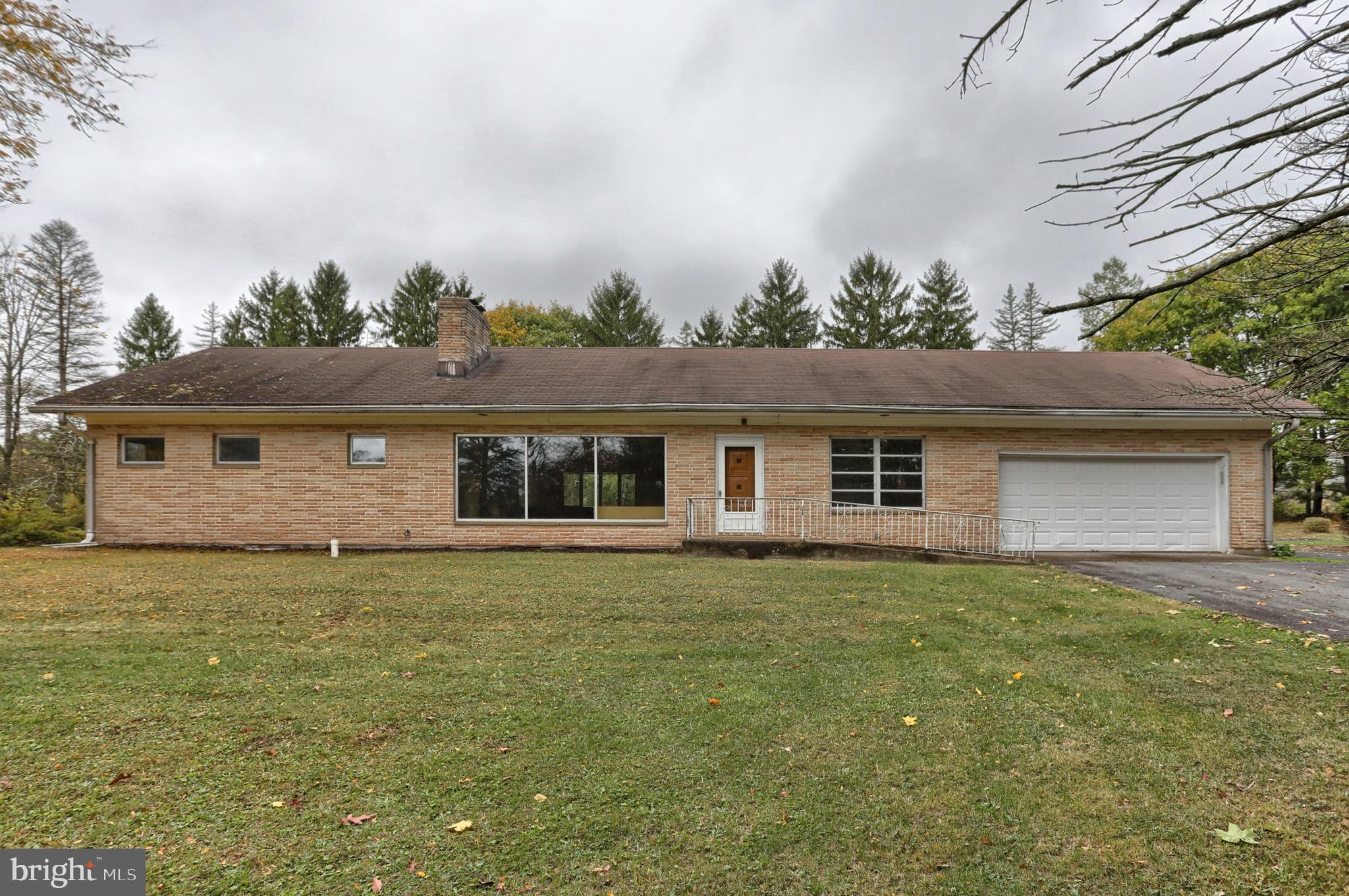 77 Tiley Road Ashland, PA 17921 - Photo 19 of 35 a front view of a house with a garden