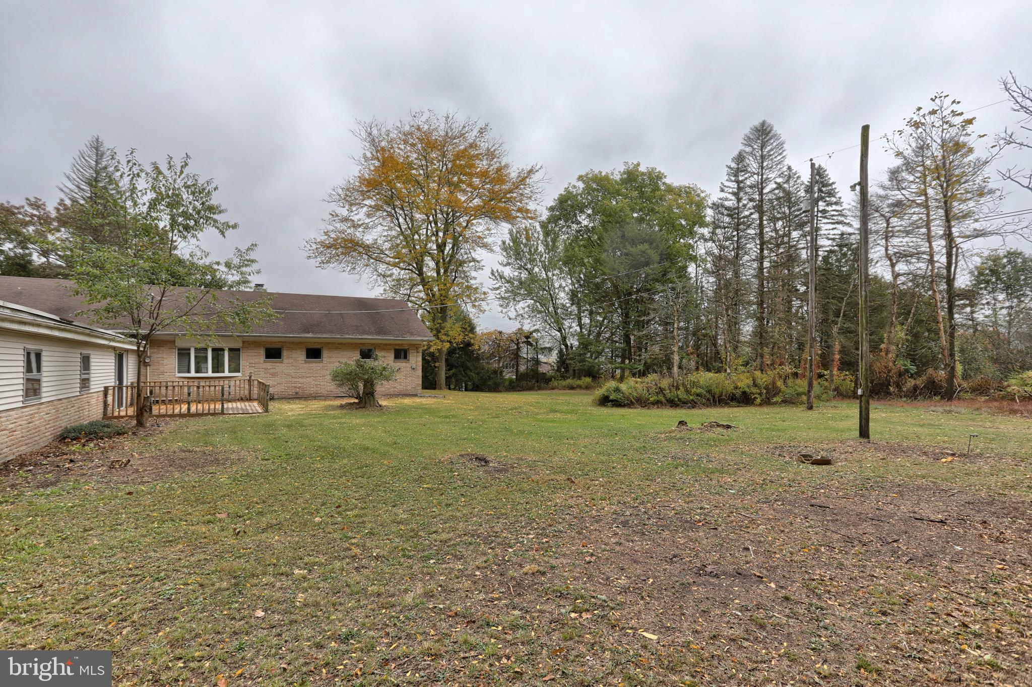 77 Tiley Road Ashland, PA 17921 - Photo 27 of 35 a view of a big house with a big yard and large trees