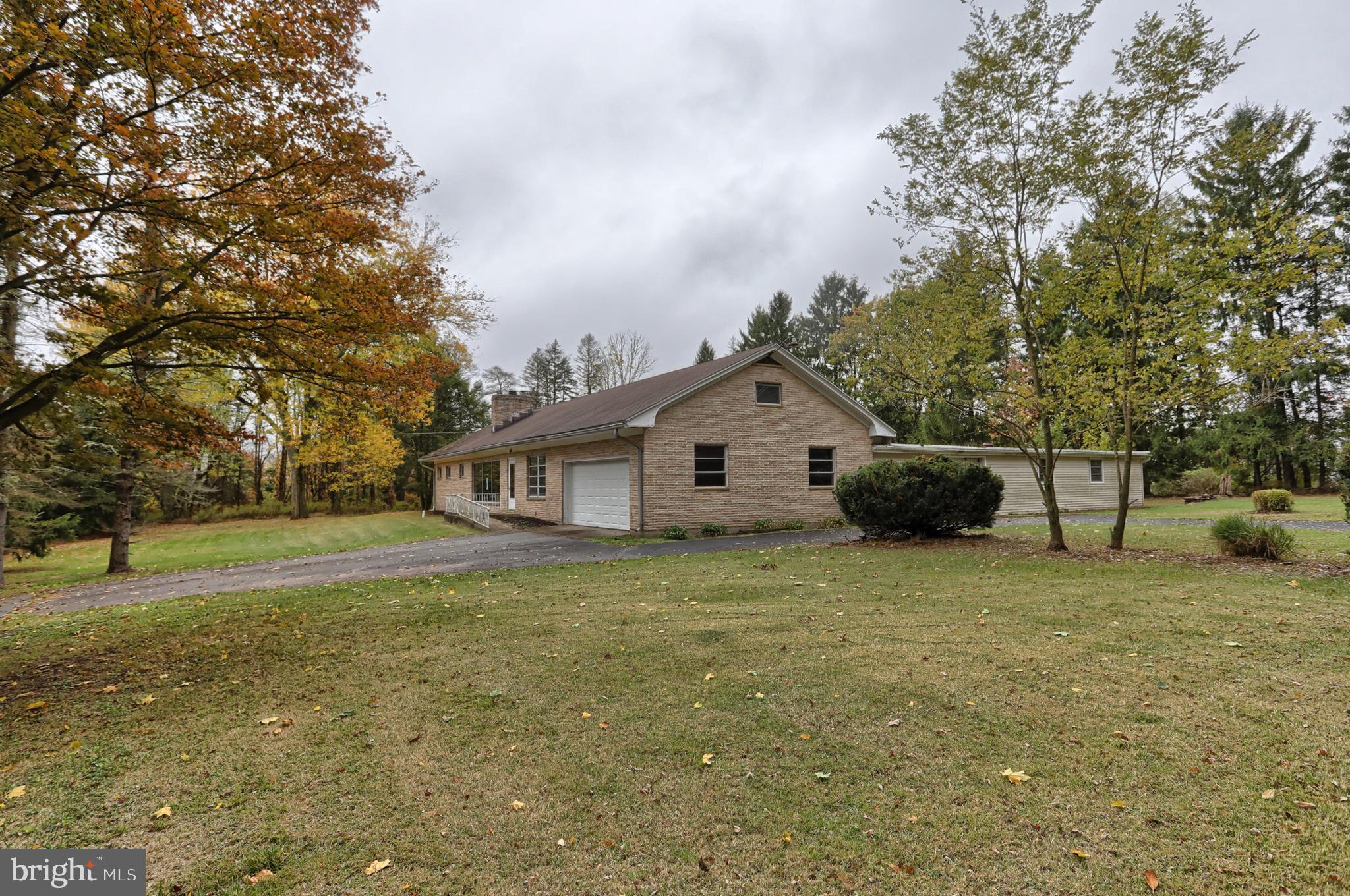 77 Tiley Road Ashland, PA 17921 - Photo 32 of 35 a house with trees in the background