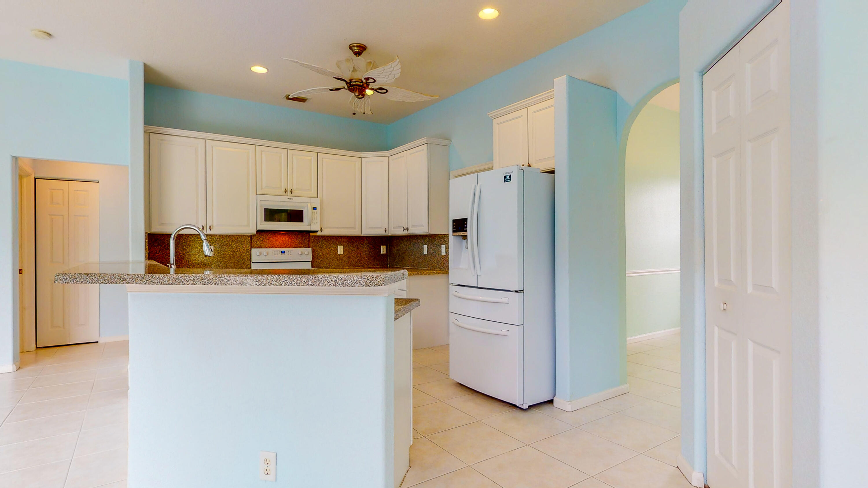 2072 Southeast Hanford Road Port St. Lucie, FL 34952 - Photo 16 of 48 a kitchen with stainless steel appliances a refrigerator sink and microwave