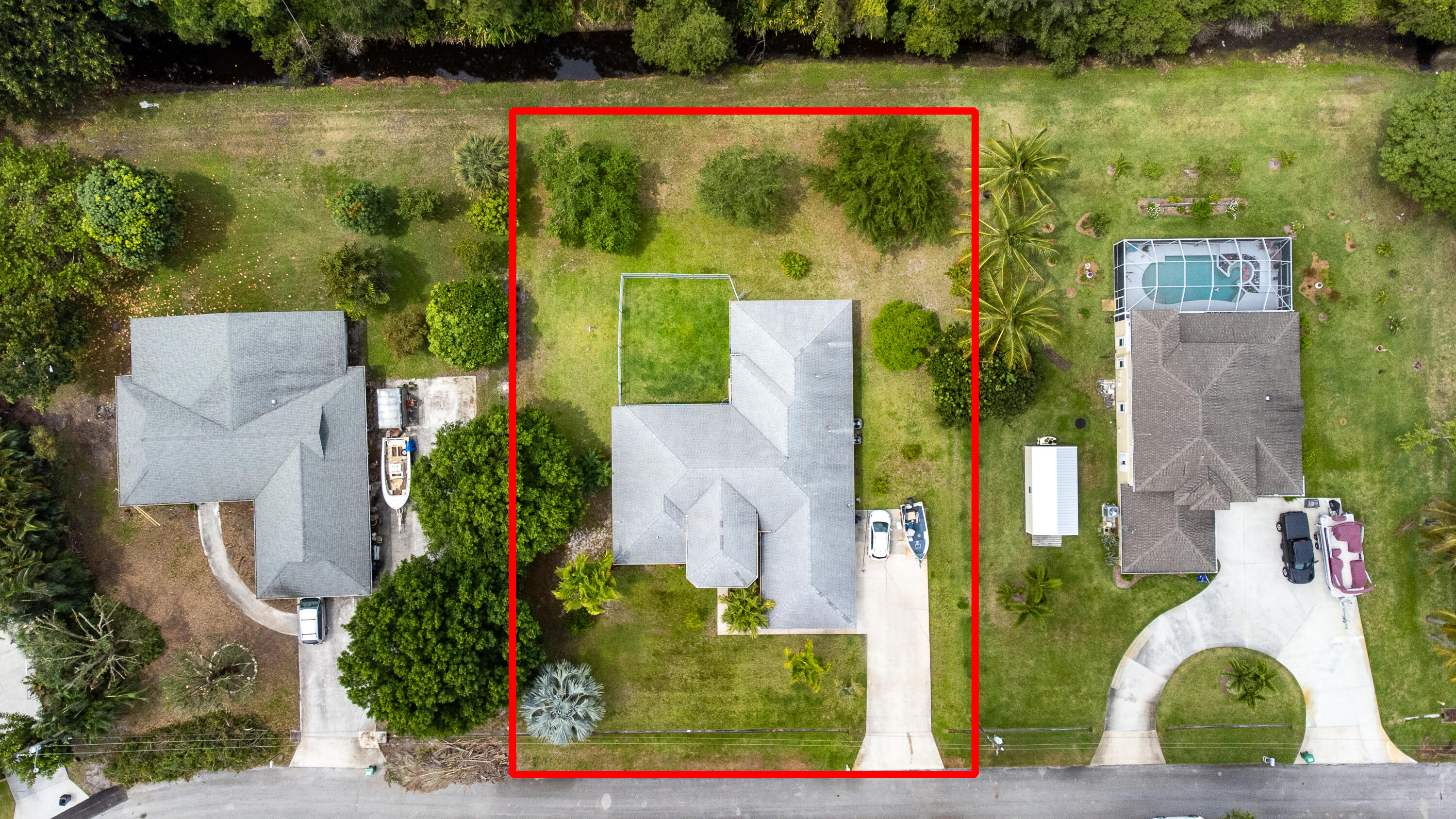 2072 Southeast Hanford Road Port St. Lucie, FL 34952 - Photo 2 of 48 an aerial view of a house with a garden and lake view