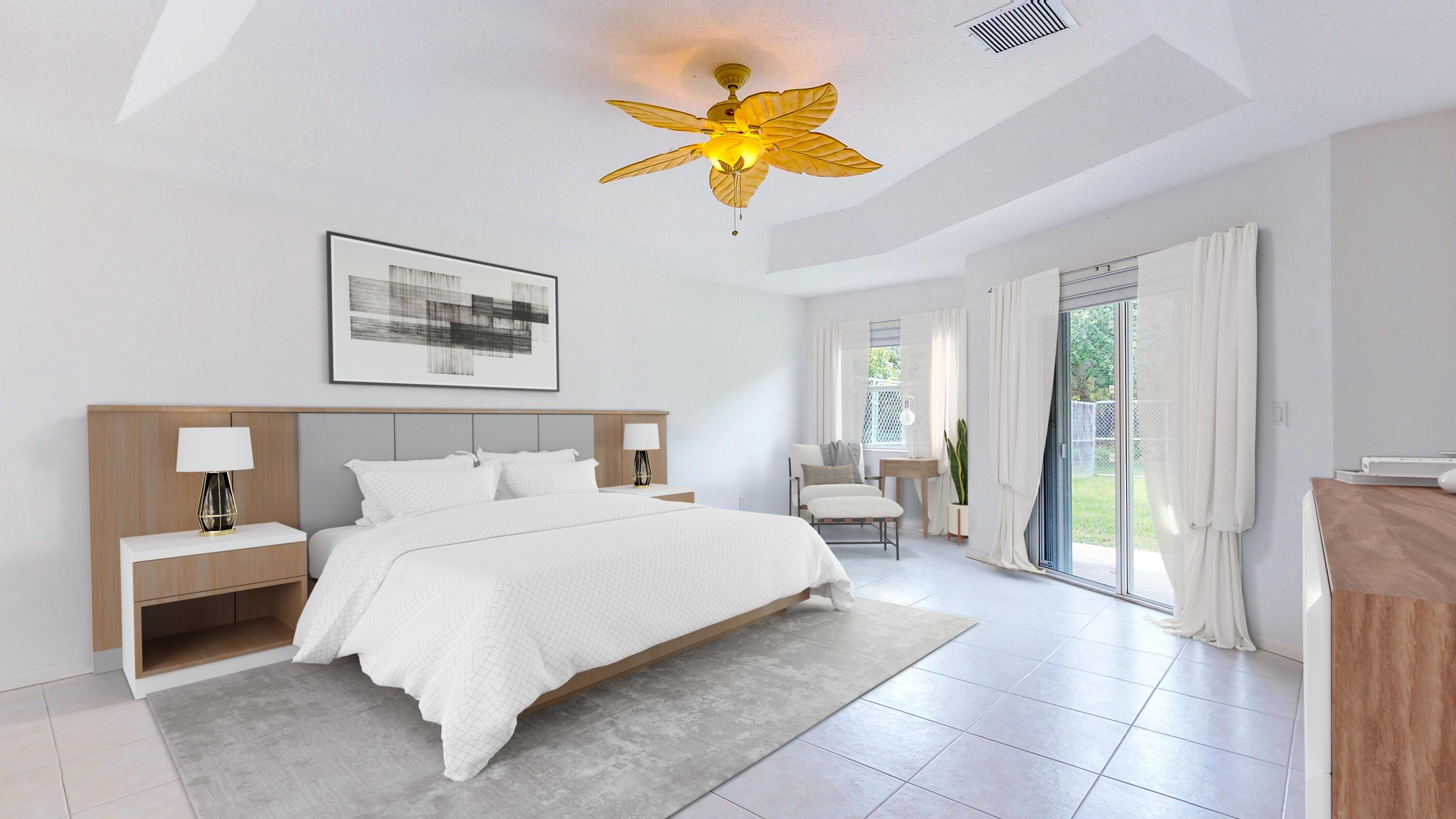 2072 Southeast Hanford Road Port St. Lucie, FL 34952 - Photo 21 of 48 a bedroom with a bed and a chandelier