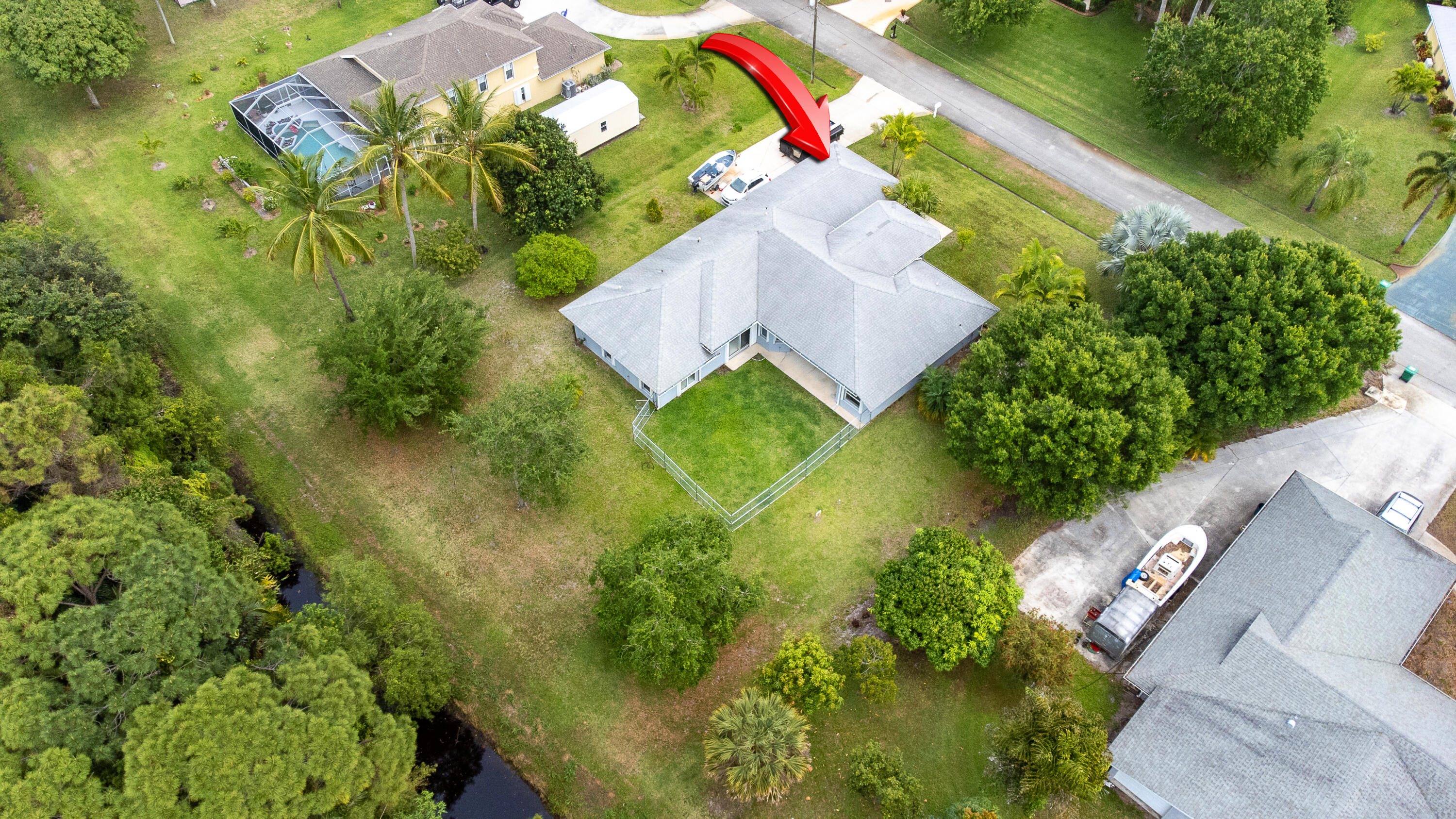 2072 Southeast Hanford Road Port St. Lucie, FL 34952 - Photo 44 of 48 an aerial view of a house with a yard and garden