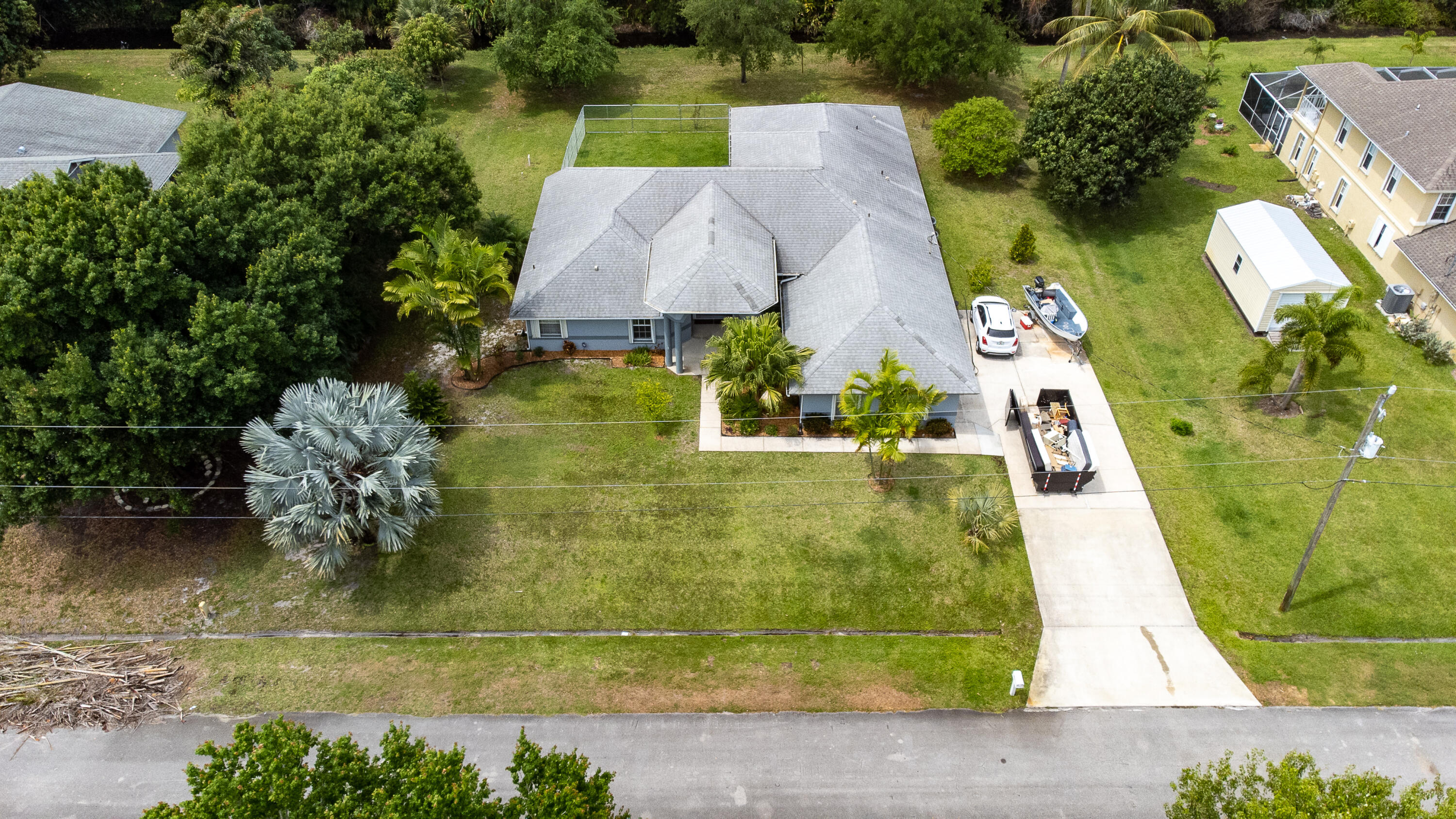 2072 Southeast Hanford Road Port St. Lucie, FL 34952 - Photo 46 of 48 an aerial view of a house with swimming pool and lake view