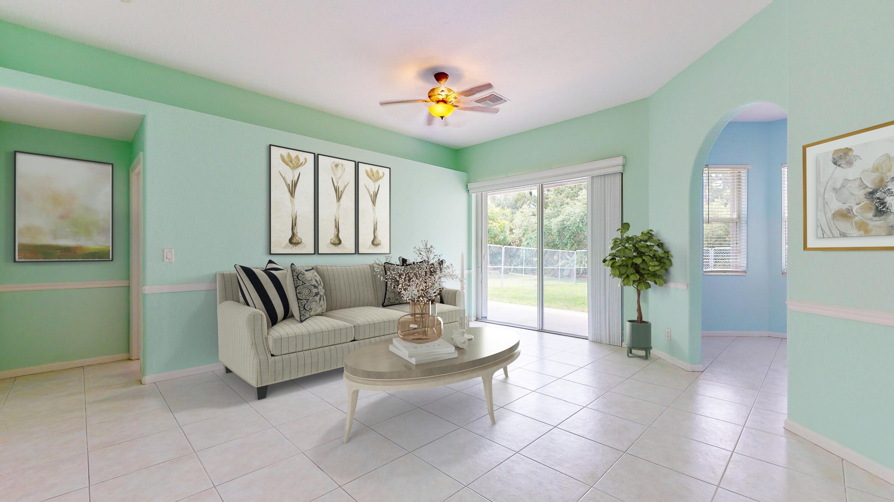 2072 Southeast Hanford Road Port St. Lucie, FL 34952 - Photo 6 of 48 a living room with furniture and a large window