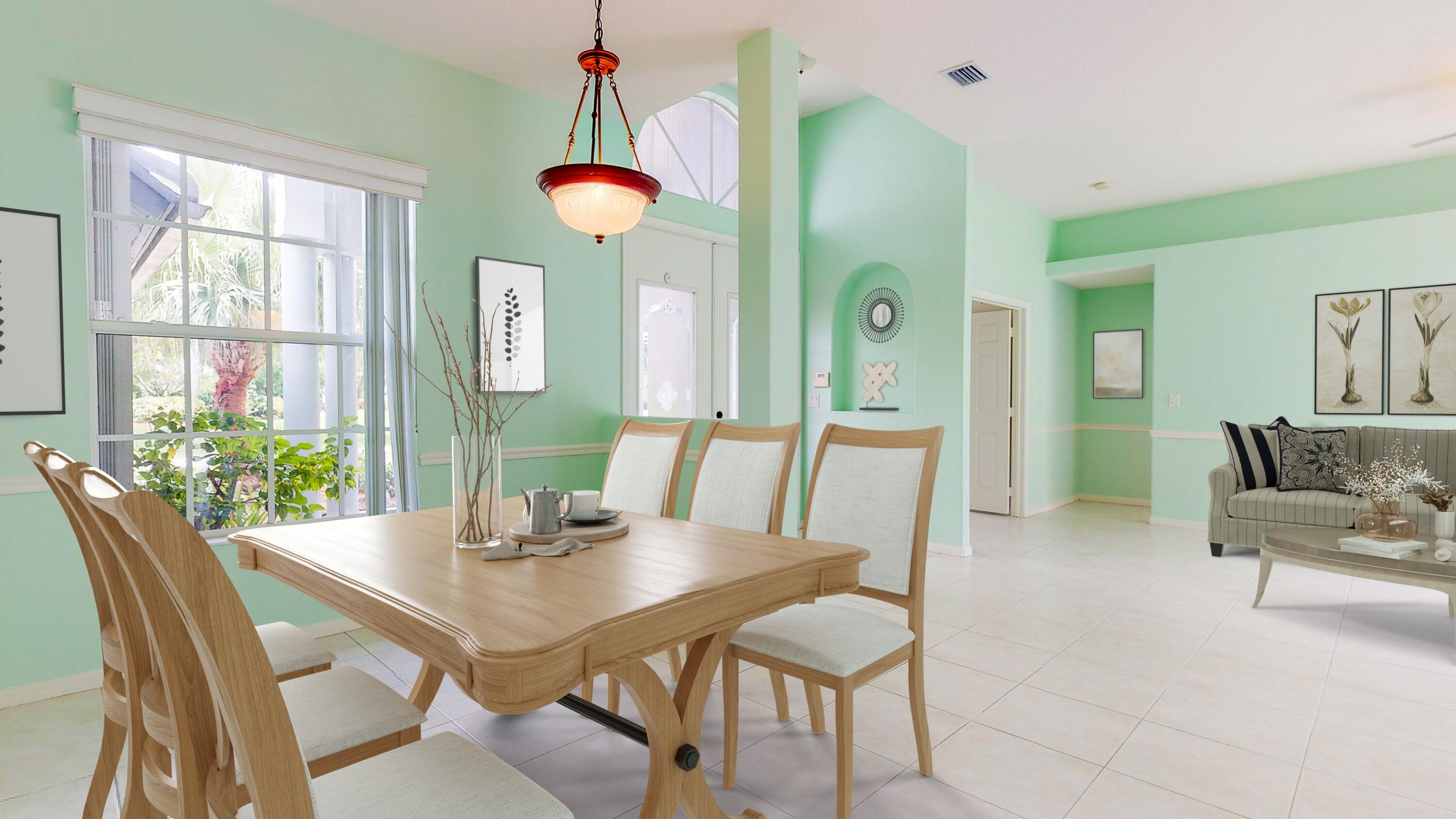 2072 Southeast Hanford Road Port St. Lucie, FL 34952 - Photo 8 of 48 a view of a dining room with furniture and a large window