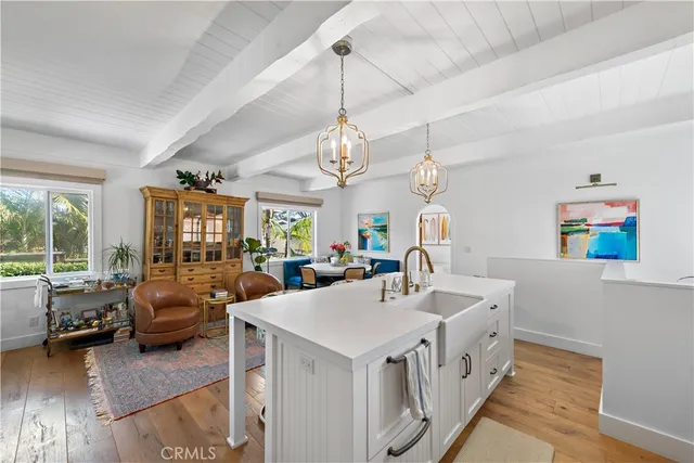 a view of living room with furniture and large windows