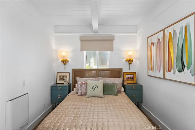 a bedroom with a bed and window