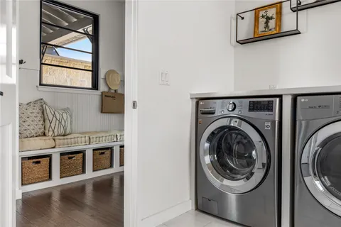 a view of kitchen with sink and wooden floor