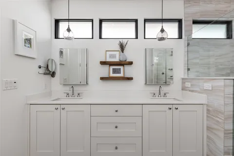 a view of a storage and utility room with washer and dryer