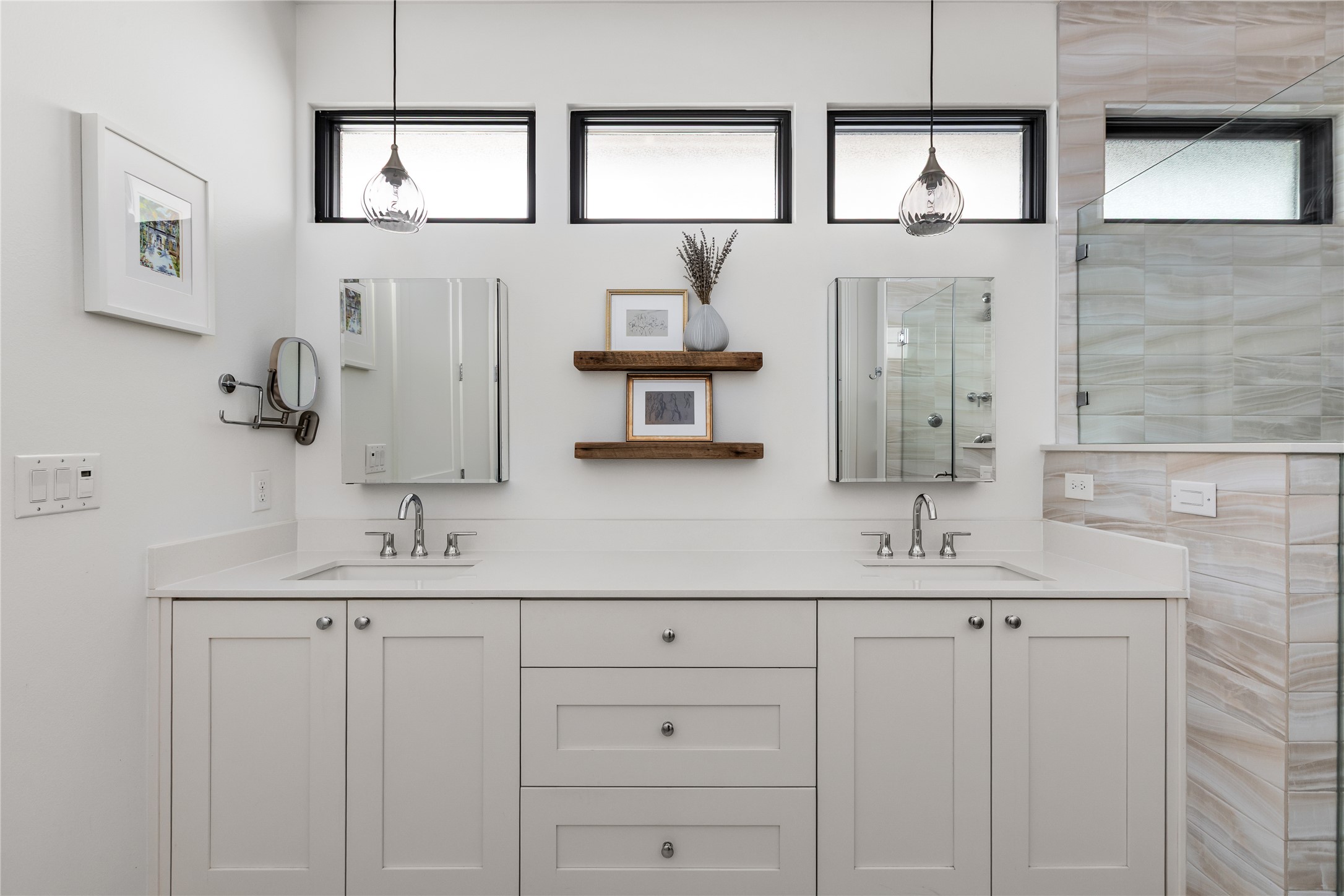 412 Kayak Way Lakeway, TX 78738 - Photo 16 of 32 a bathroom with a double vanity sink and a mirror