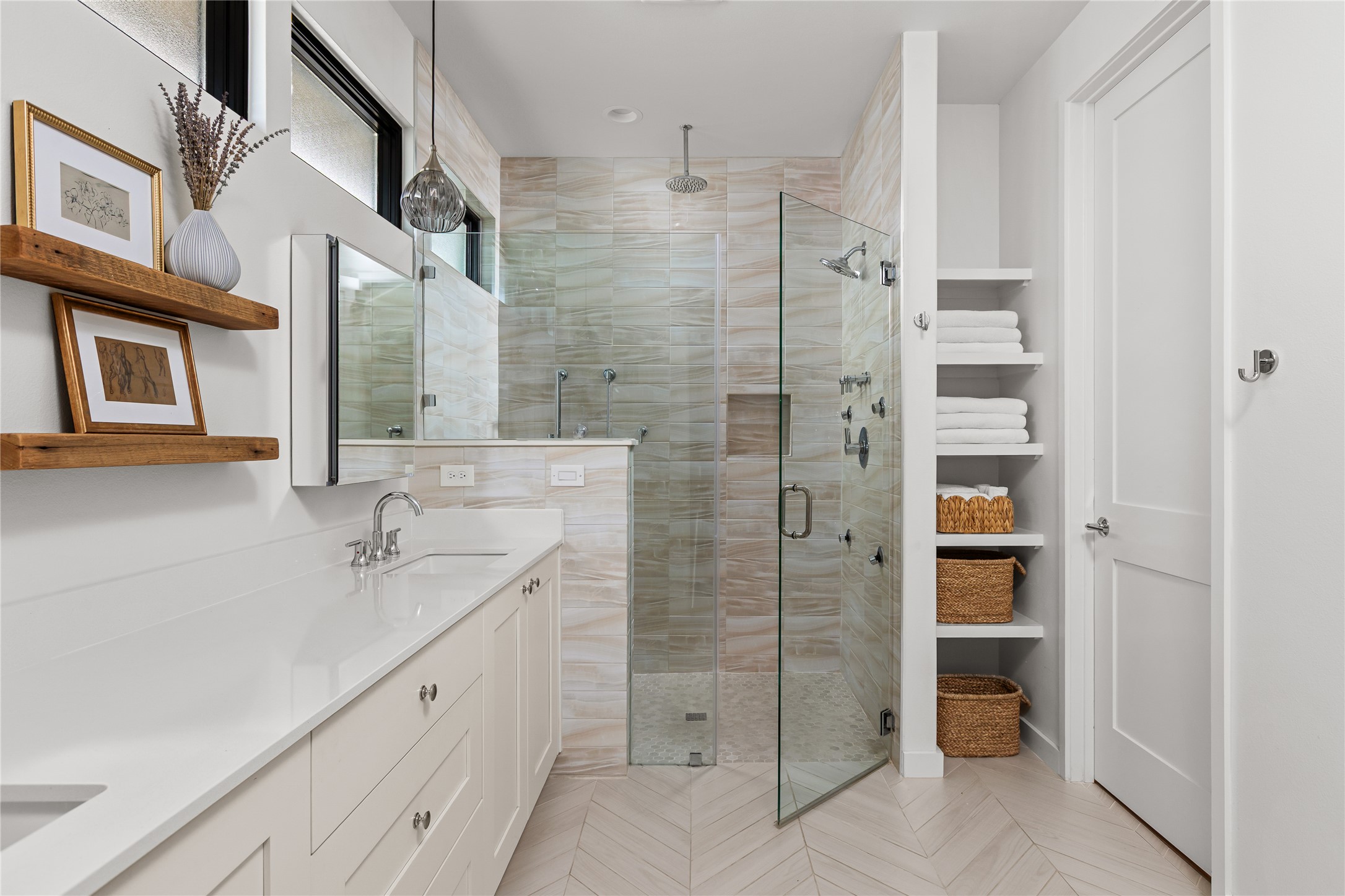 412 Kayak Way Lakeway, TX 78738 - Photo 17 of 32 a spacious bathroom with a shower and a double vanity sink a mirror