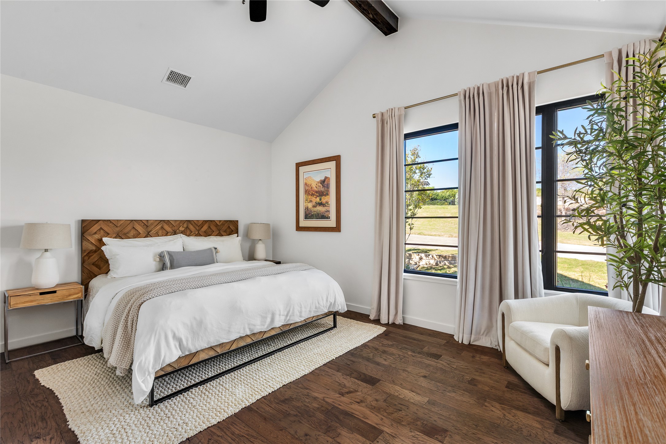 412 Kayak Way Lakeway, TX 78738 - Photo 19 of 32 a bedroom with a large bed and a window